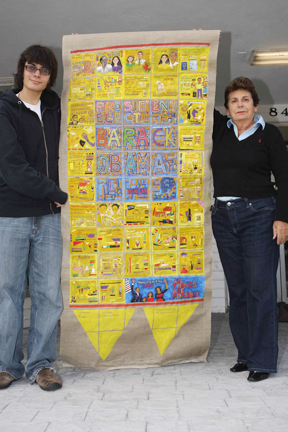 Alex Lehrhoff and his grandmother Calliope Babu-Khan display the Barack Obama banner that Babu-Khan created for the President-elect.